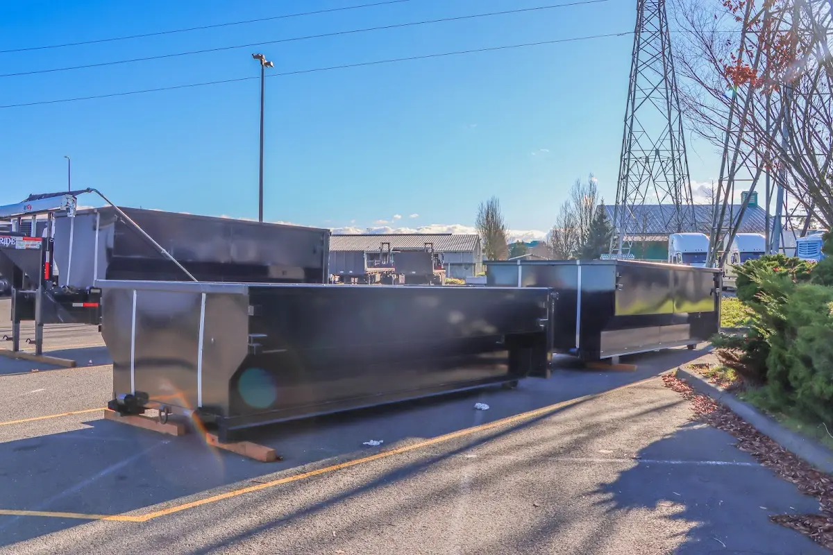 Roll-off dumpster ready for waste disposal at job site for Roofing Dumpster Rental in Wells